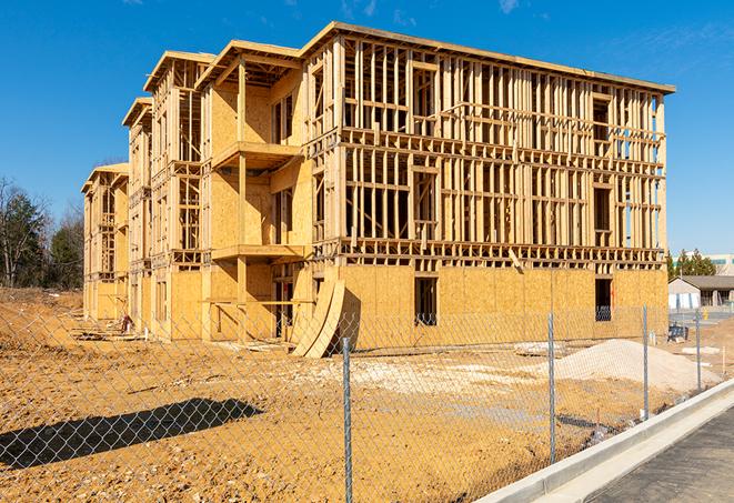 a temporary chain link fence locking away a building under renovation, serving as a security tool in Corrales NM